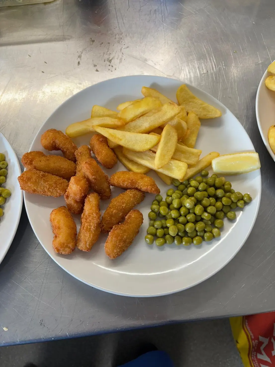 Cheeseburger with fries on wooden board